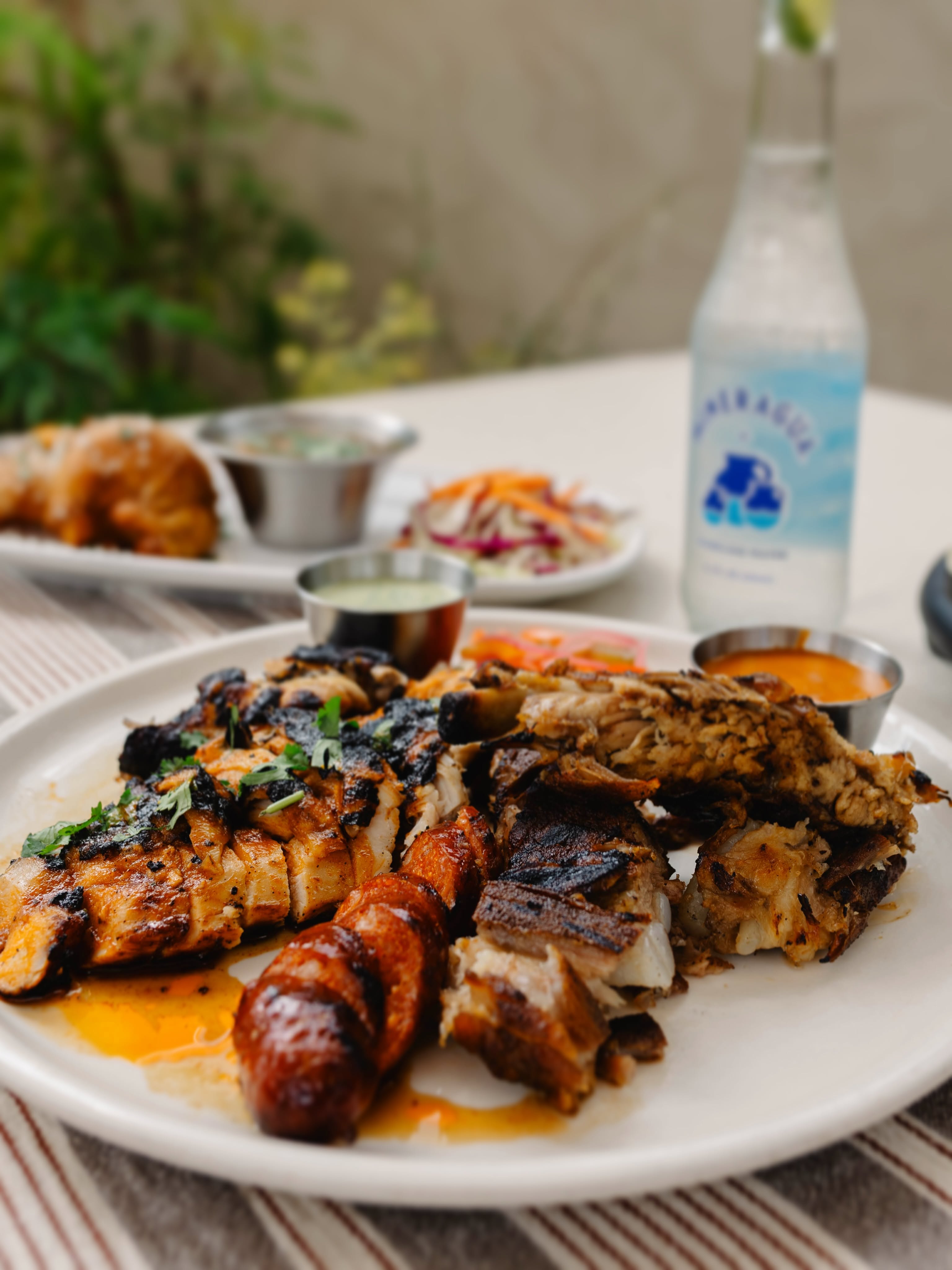 Come hungry.
The new Big Tex Platter brings together dry-rubbed ribs, local hot link sausage, chipotle honey butter chicken, and all the fixings for one seriously satisfying fall meal.
Available alongside all your fall favorites through October 11!