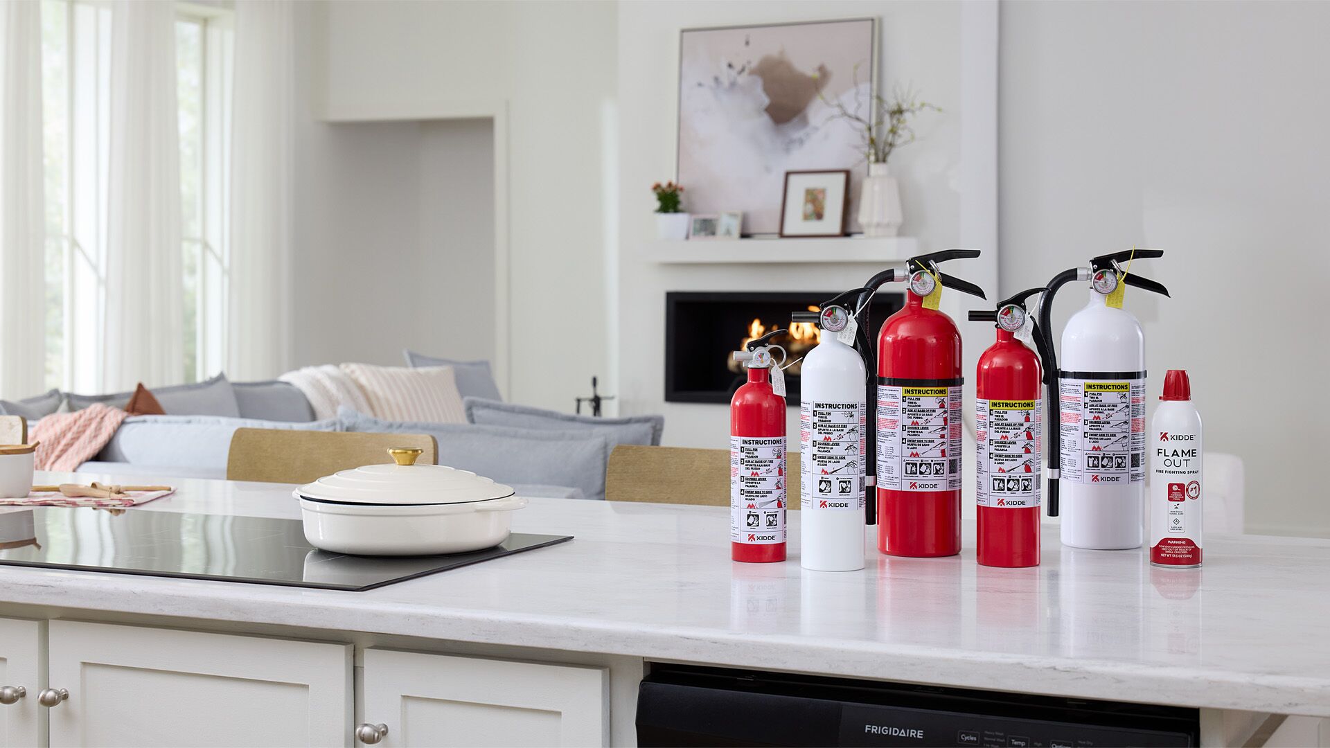 A wide range of Kidde Fire extinguishers on a kitchen countertop