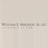 William E. Maddox Jr., L.L.C. Logo