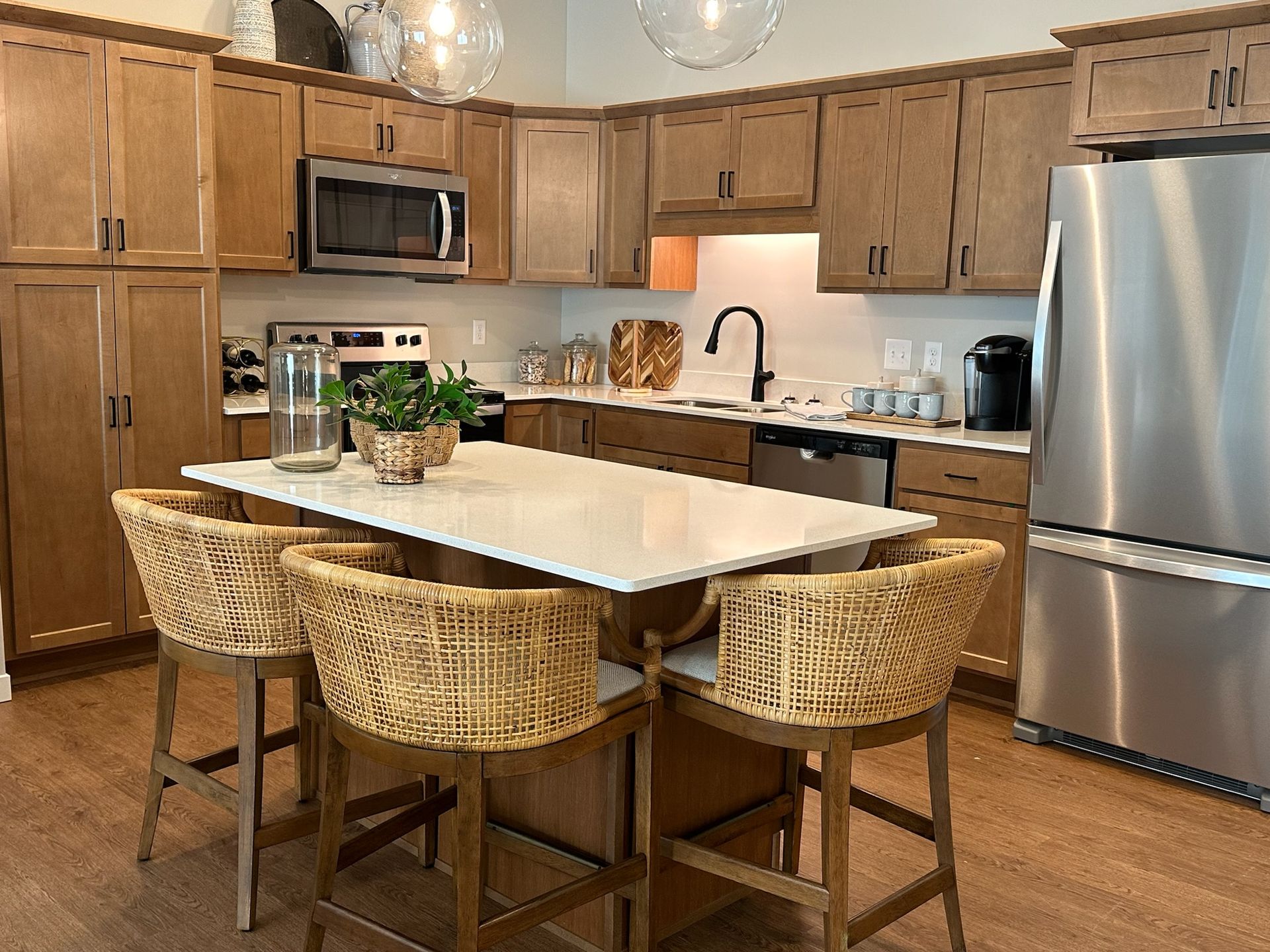 Apartment kitchens at Corcoran include full-size appliances and an island.