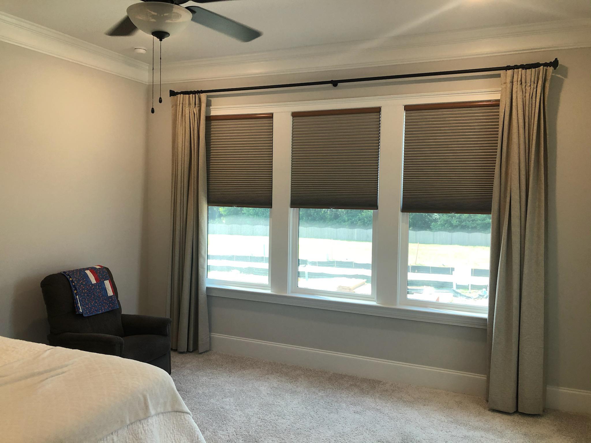 drapery and shades provide the perfect serene environment