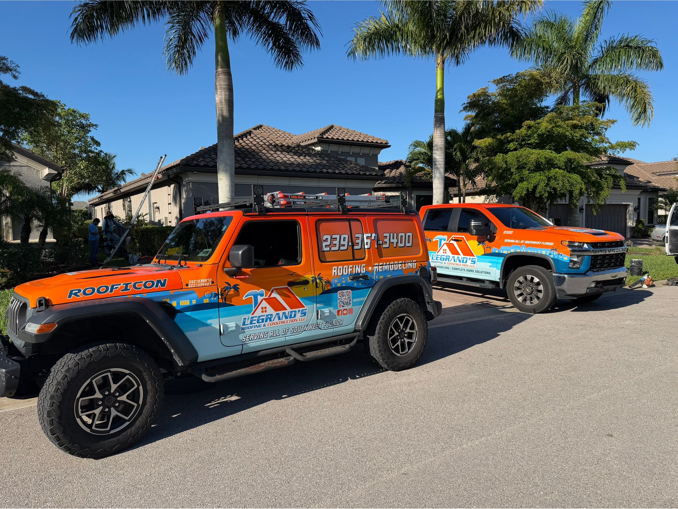 Branded Legrand’s Roofing & Construction truck parked outside a home, representing local roofing ser 