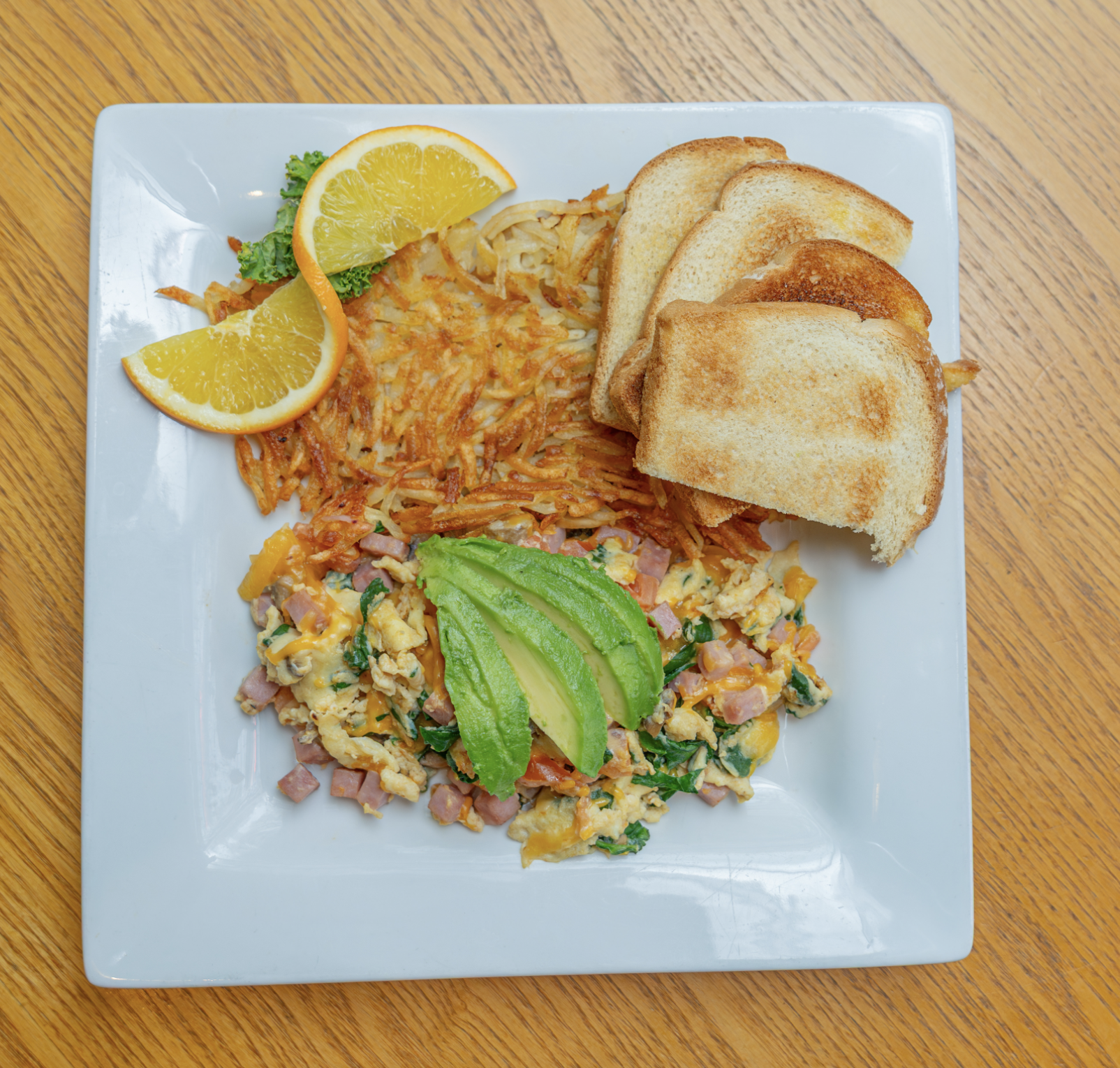 A variety of egg scrambles or omelets, served with either hash browns or fresh fruit, with your choice of toast or homemade biscuit. Substitutions for egg white or no-cholesterol eggs available.