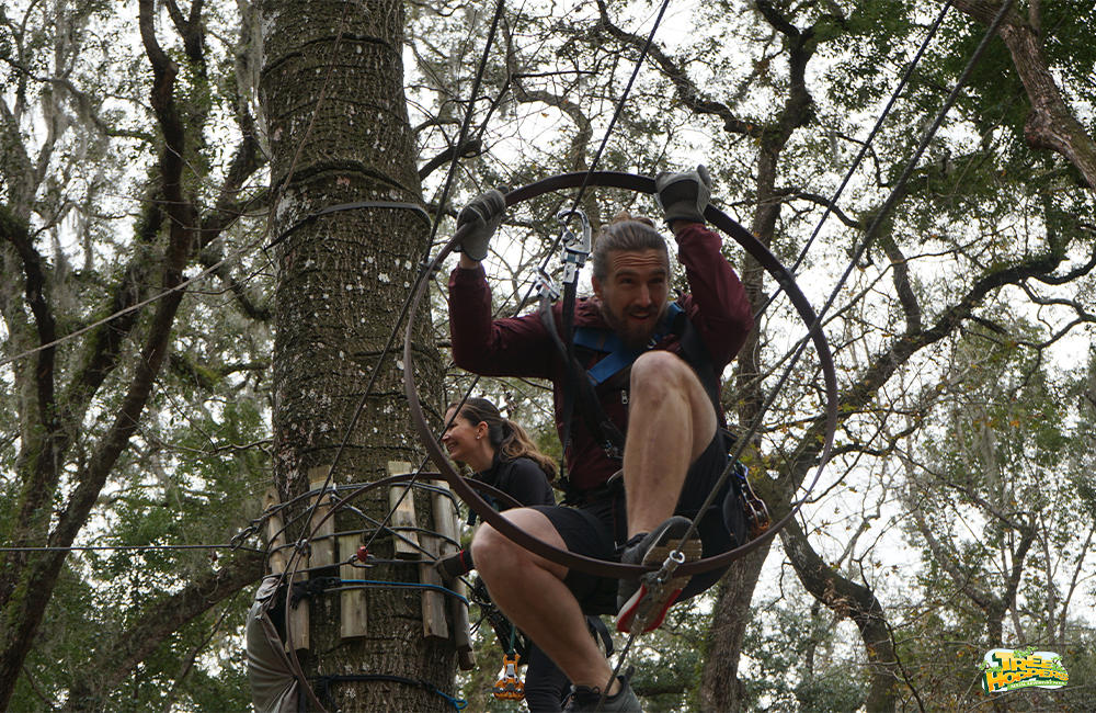 Crawl through obstacles at TreeHoppers TreeHoppers Aerial Adventure Park Dade City (813)381-5400
