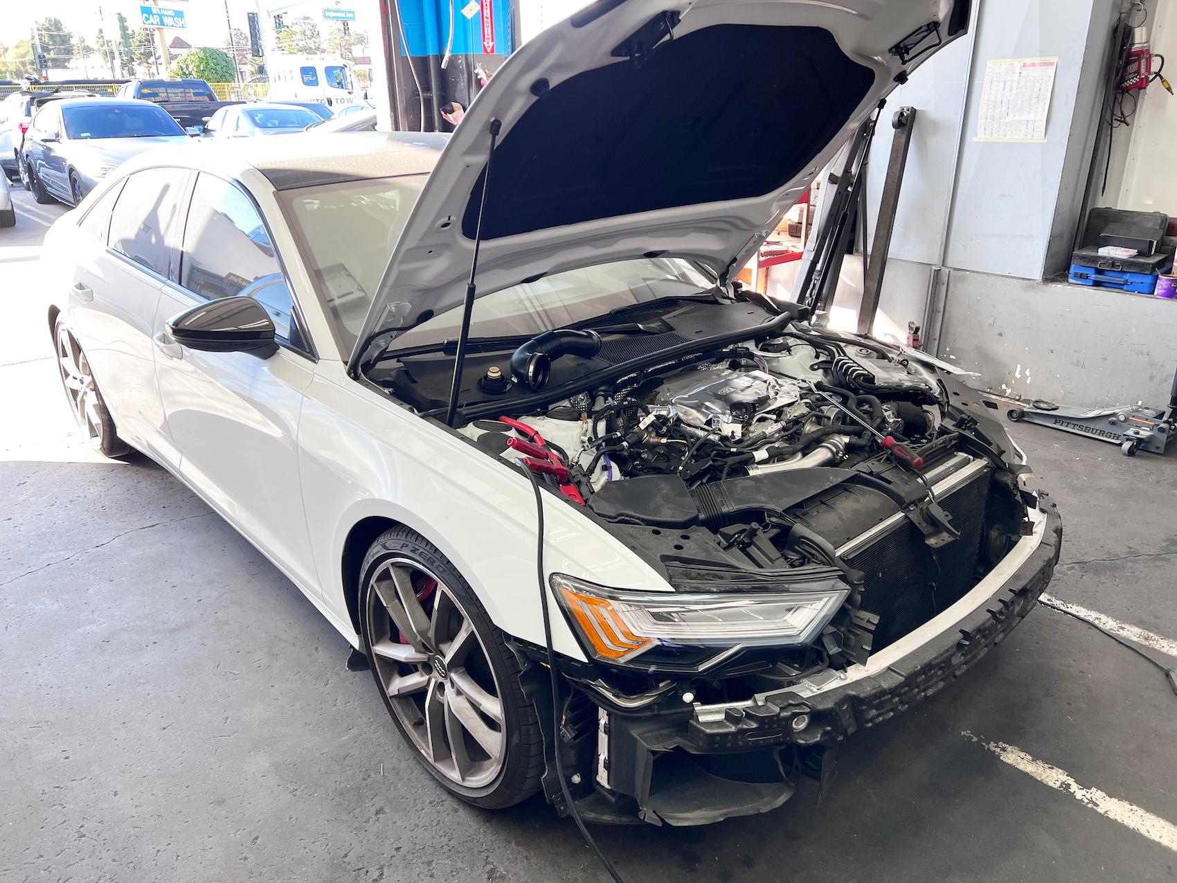 Detailed photo of Audi at auto body shop parking lot for collision repair