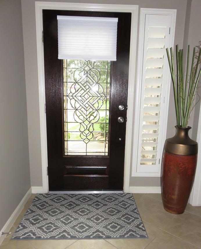 Are you looking for the perfect window designs for the foyer of your Katy, TX home? If so, consider installing our Plantation Shutters and Hunter Douglas Cordless Honeycomb Shades. #BudgetBlindsKatySugarLand #PlantationShutters #HunterDouglasShades #HoneycombShades #ShutterAtTheBeauty #ShadesOfBeaut