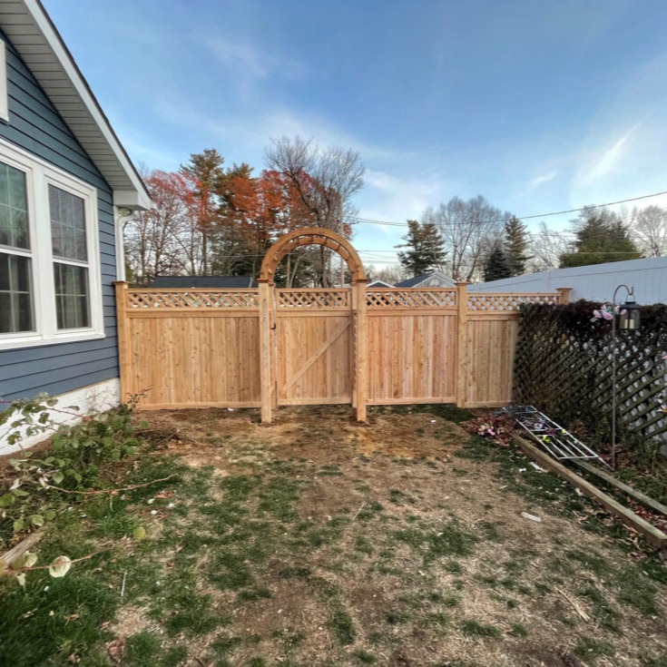 For this residential project in Derry, NH, our team installed two beautiful styles of 6&prime; High Cedar Board Privacy Fencing. The first section included a 3&prime; wide cedar gate, providing clean and solid privacy.