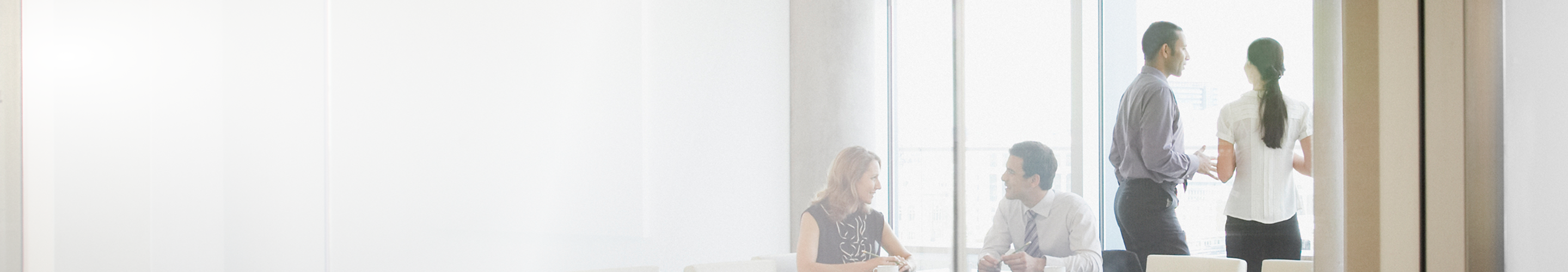 Wealth professionals collaborating in an office setting.