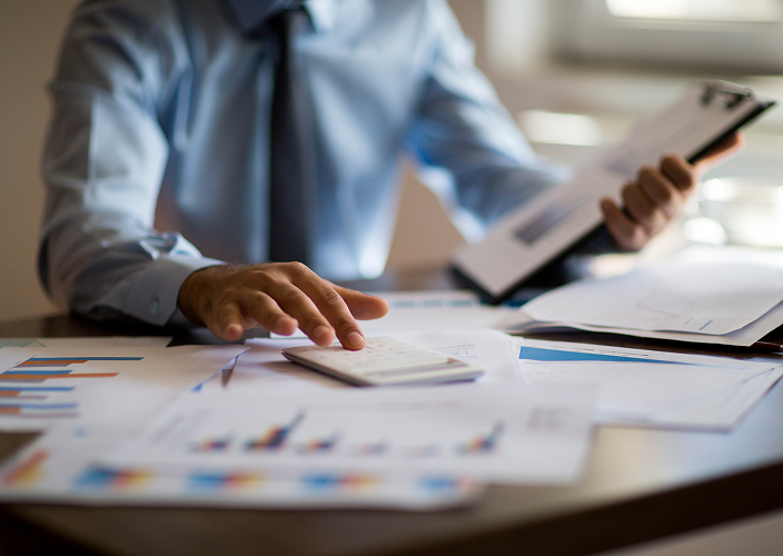 An advisor working at their desk.