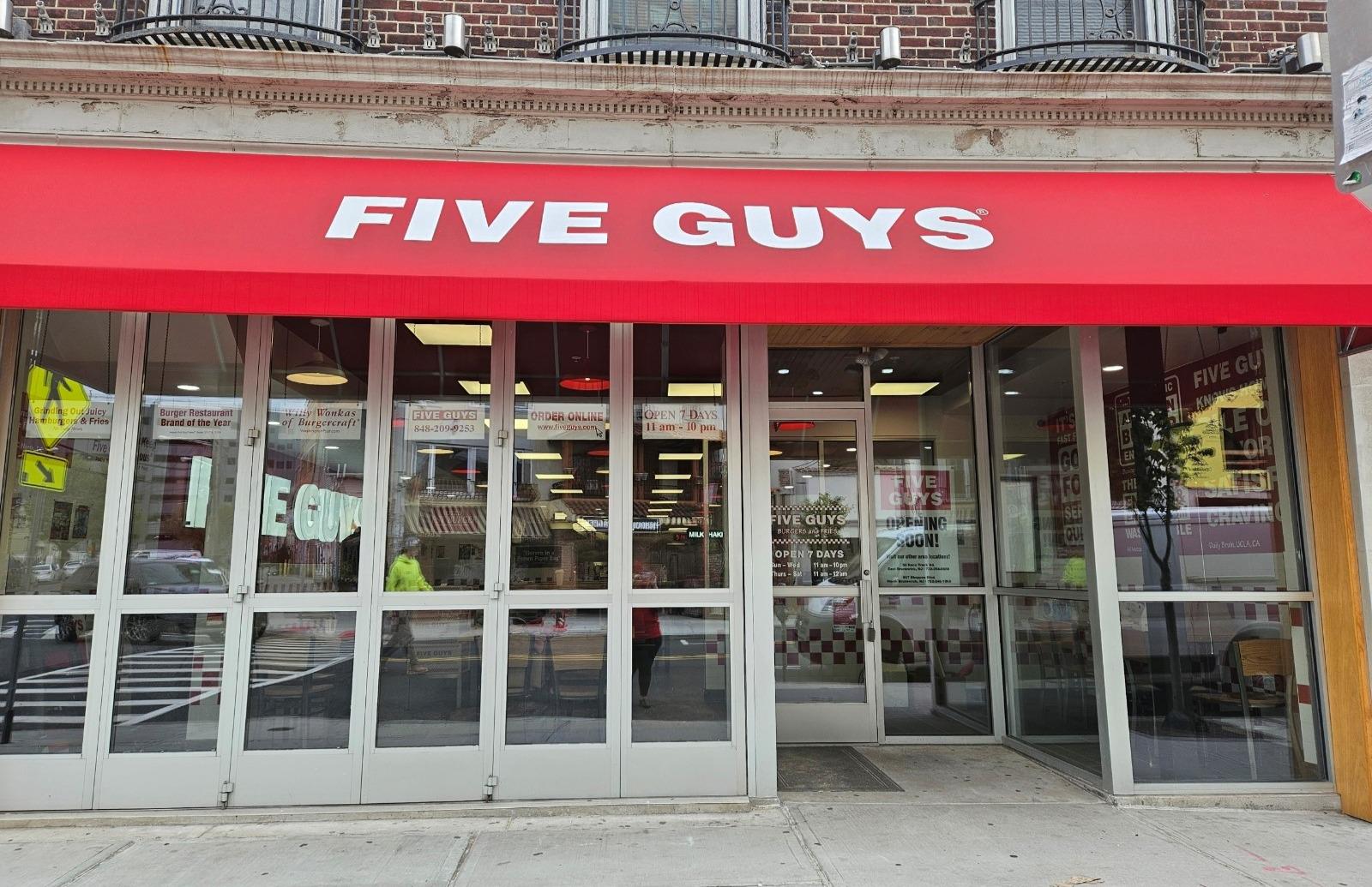 Exterior photograph of the Five Guys restaurant at 47 Easton Avenue in New Brunswick, New Jersey.