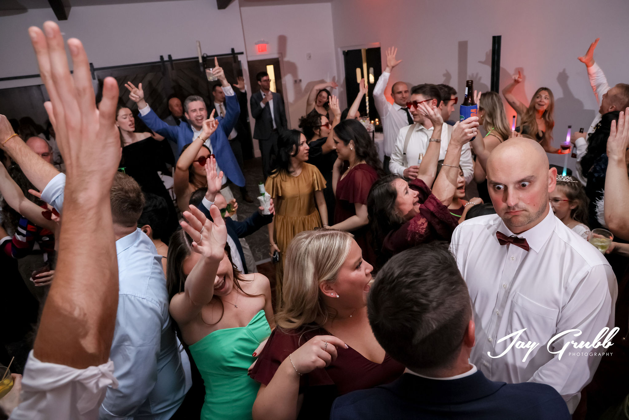 dj entertaining crowd on dance floor at wedding 