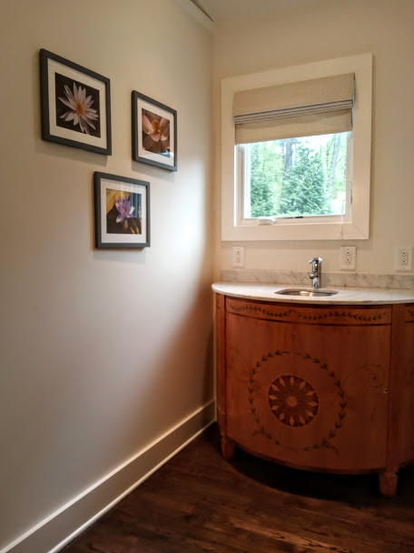 You can dress up even the smallest of spaces with a nice window treatment. In this case we installed a sweet Roman Shade that provides decoration for that cute hall window.