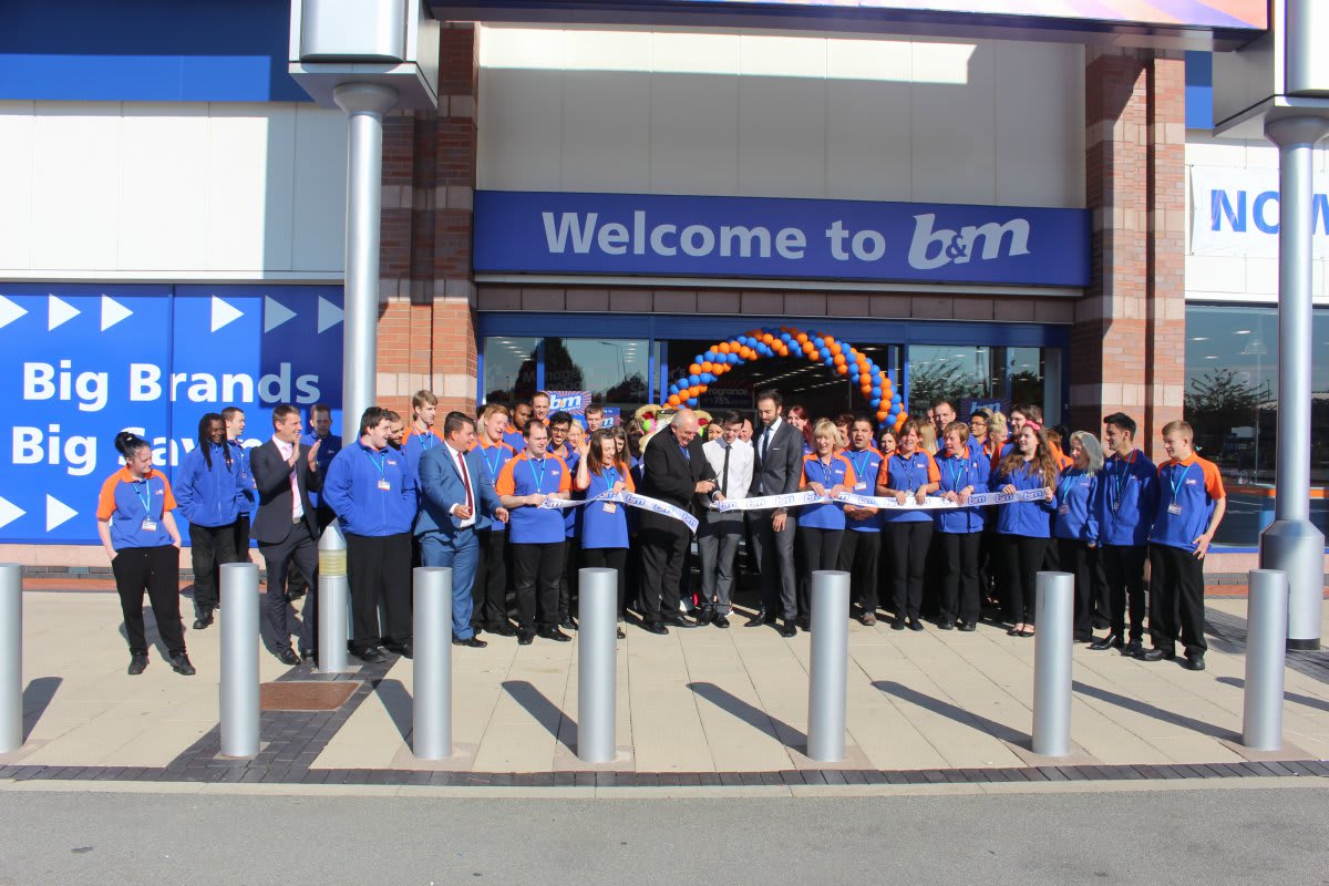B&M Urmston, Trafford Retail Park is officially opened by the Lord Mayor of Trafford, Councillor John Holder. He is joined by the store team and representatives from Key 103's Cash for Kids charity who received £250 worth of B&M vouchers.