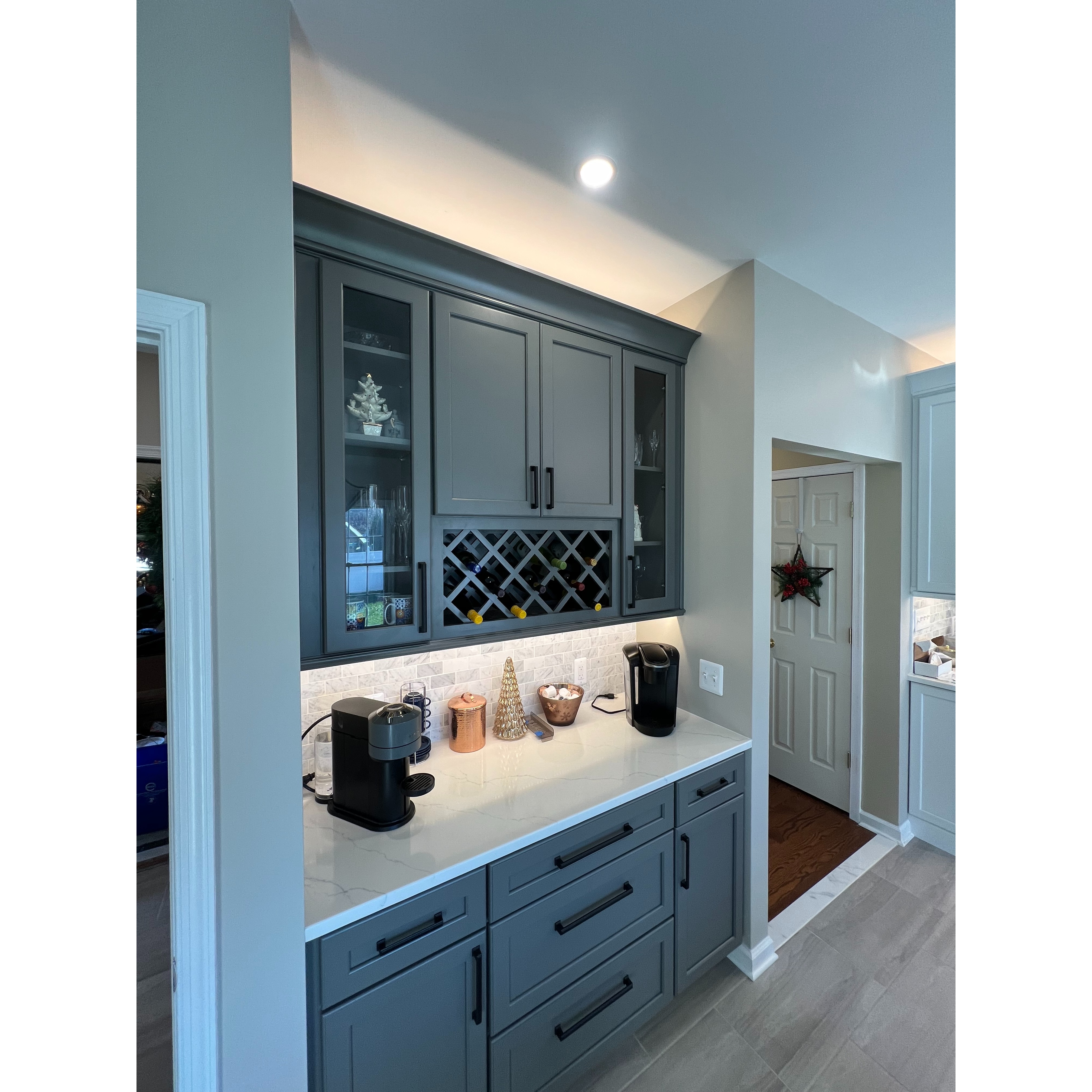 Custom kitchen coffee bar with built-in cabinetry and wine storage