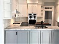 Blanco Vitoria marble kitchen countertops with a flat edge.
