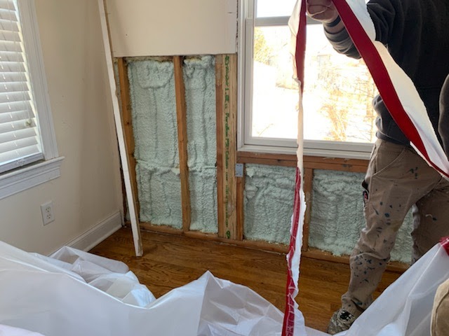 Closed-cell spray foam insulation photo showing a sealed interior wall area for improved moisture control and energy efficiency.