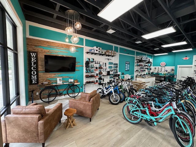 A Pedego showroom with bikes and accessories displayed.