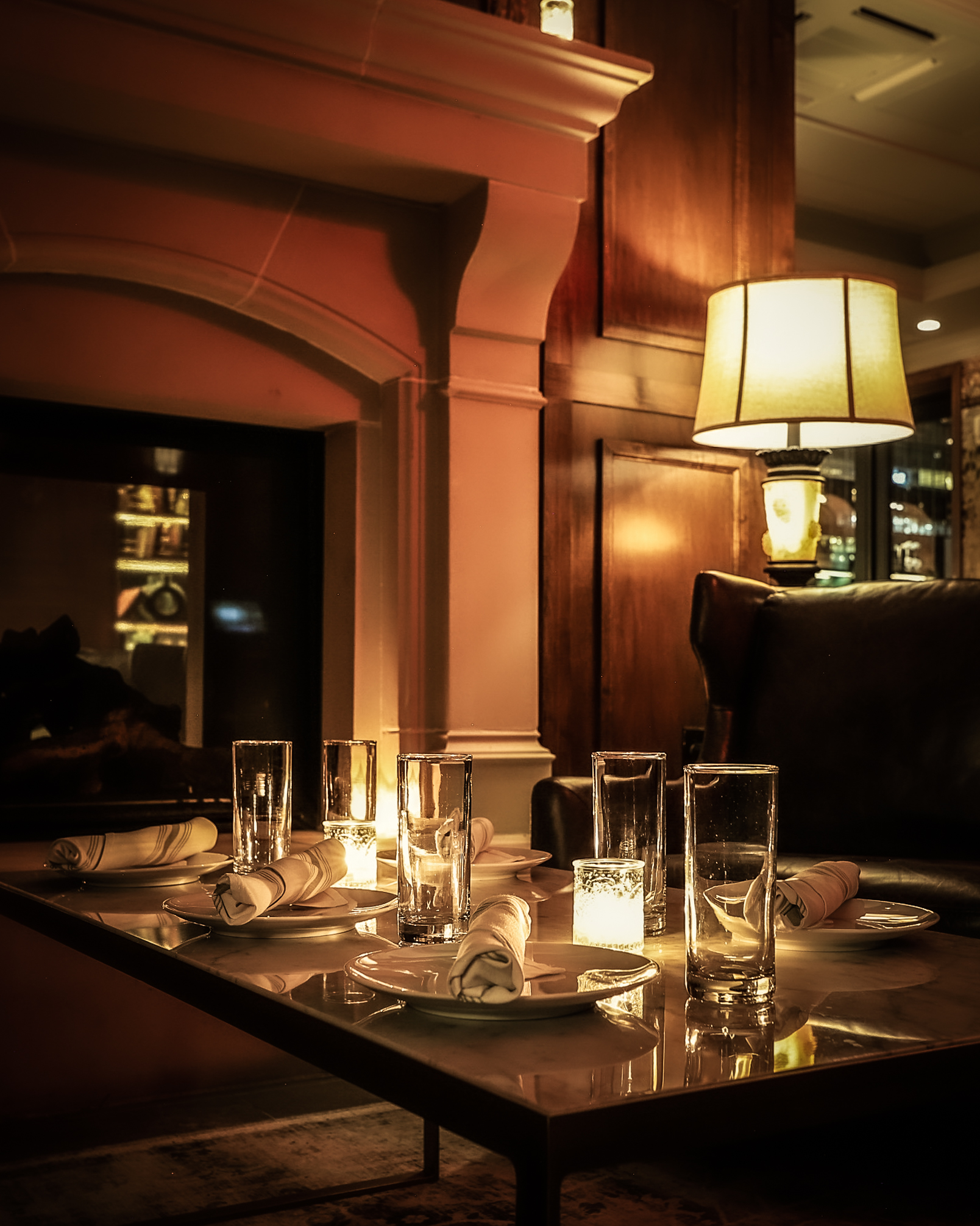 Table in the Study at Vintage Green Rooftop, candlelit at night.