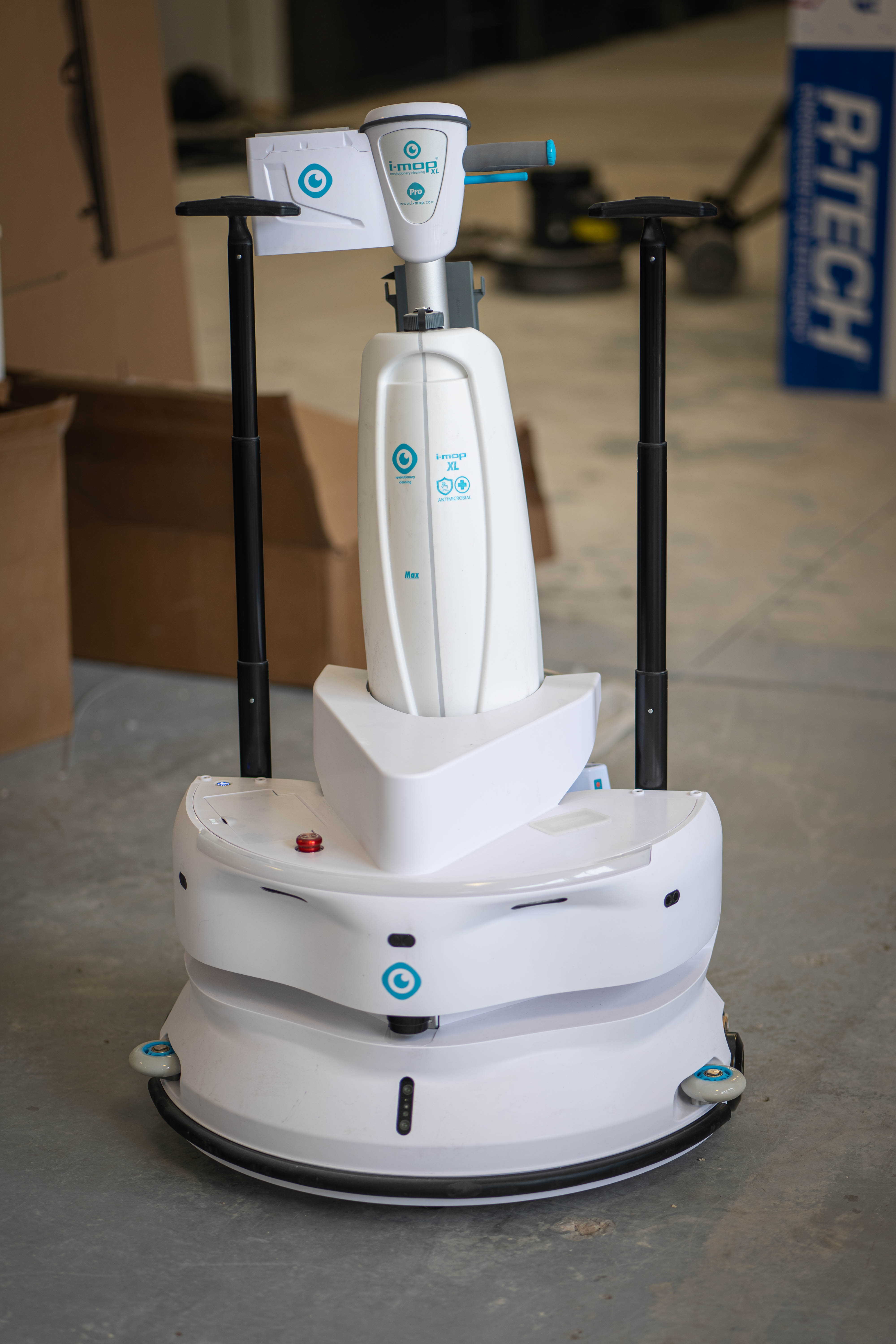 Equipment Model: i-mop XL Professional Scrubber with an autonomous robotic base
Key Visuals: White robotic chassis, i-mop XL branding, dual control handles, workshop setting
Location Context: WaySolutions commercial repair facility in Layton, Utah
Service Focus: Next-generation automated cleaning technology and robotic fleet maintenance