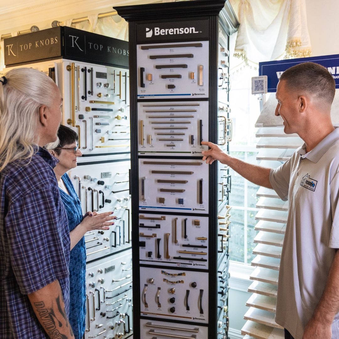 Clients explore Berenson and Top Knobs hardware options with a Fiderio team member.