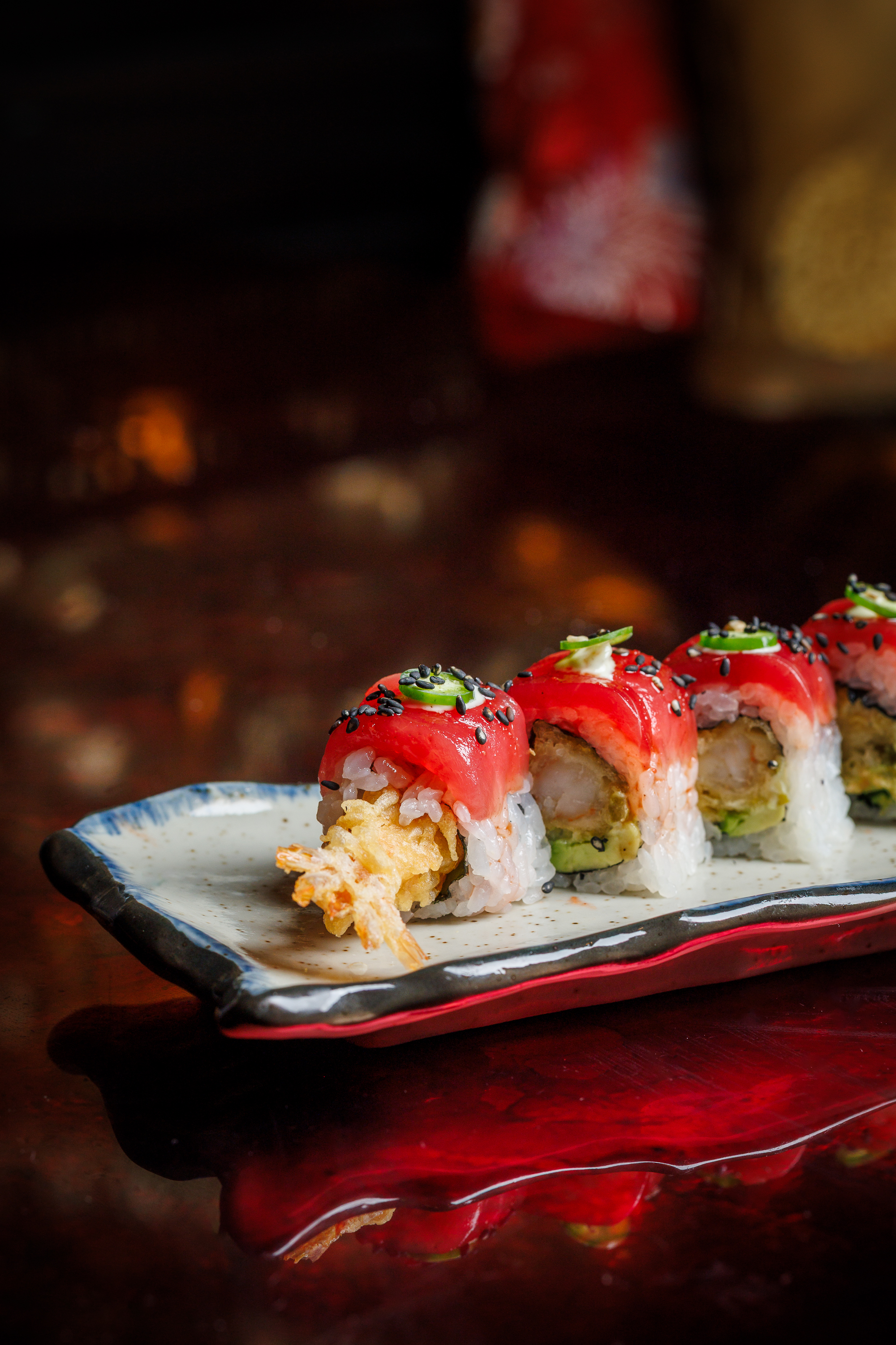 Discover the Red Dragon Roll at Mr. H, an Asian fusion restaurant in Boston's Seaport. Featuring sli 