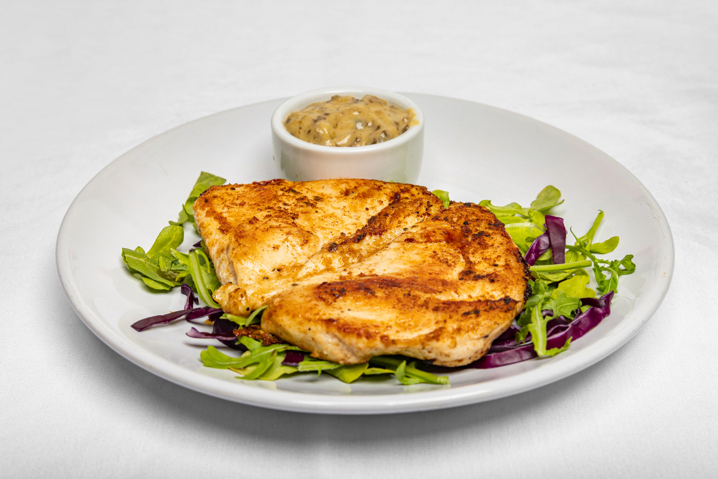 Perfectly seasoned and grilled chicken breast, tender and juicy, served with your choice of sides.