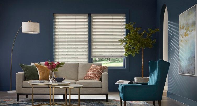Our Faux Wood Blinds are a great way to pull a color palette together! Check out this fabulous living space, where they match the sofa, lamp, and archway!