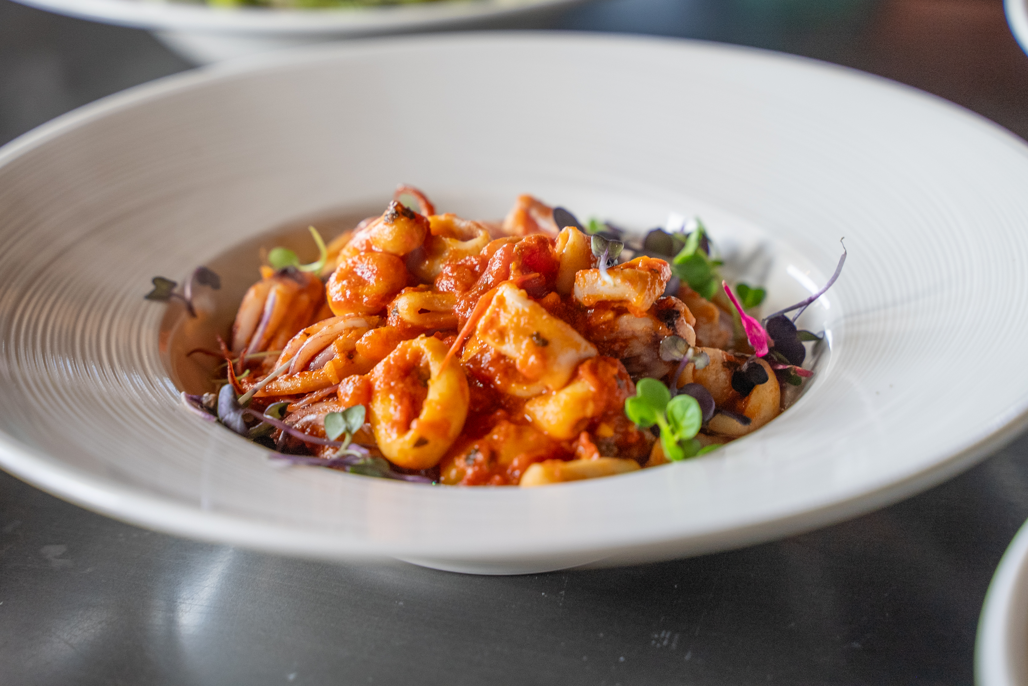 Delicious and fresh sauteed calamari in our tangy red sauce. A delicate and authentic Italian version of this popular seafood dish.