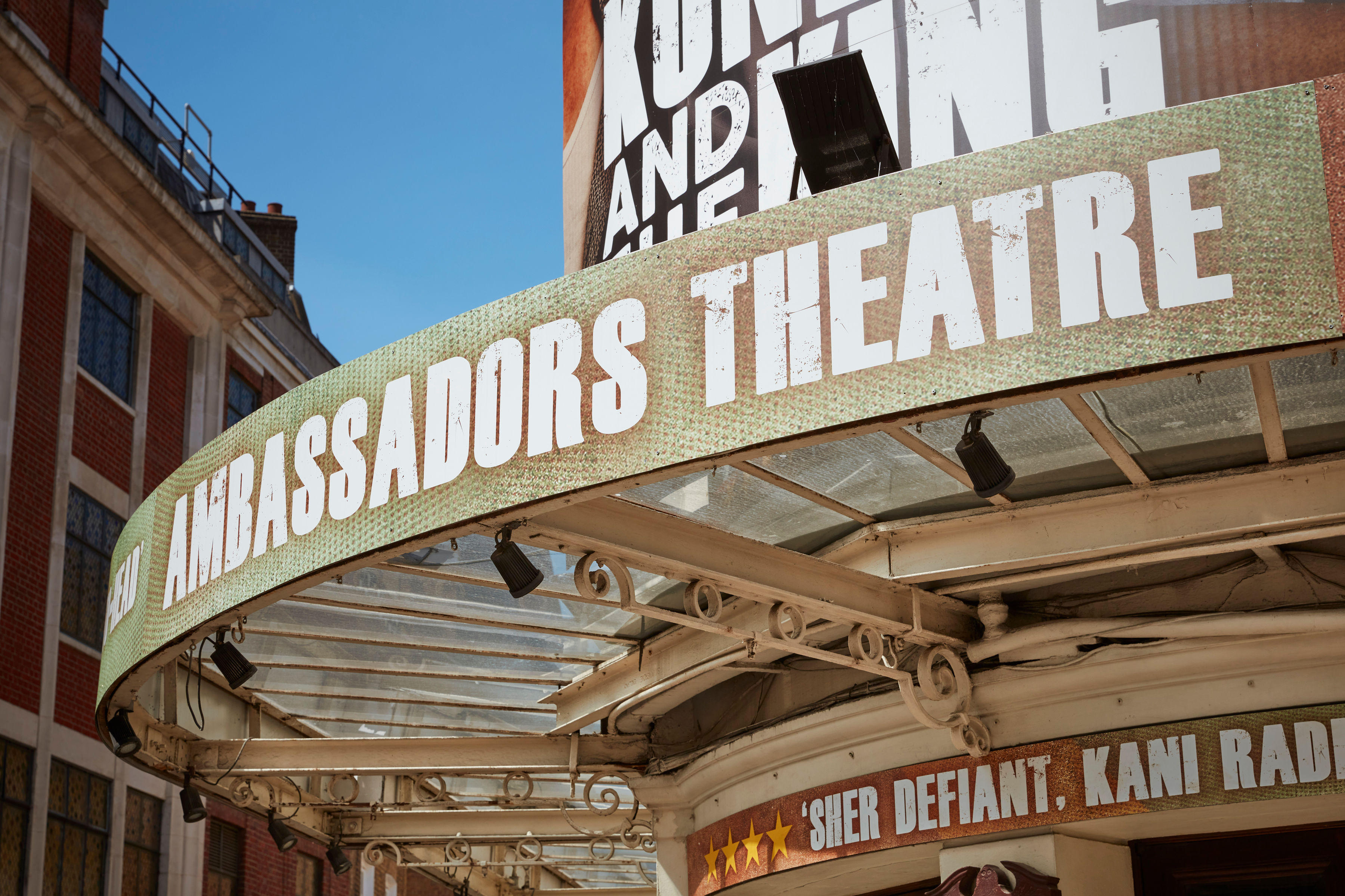 Close up of Ambassadors Theatre signage