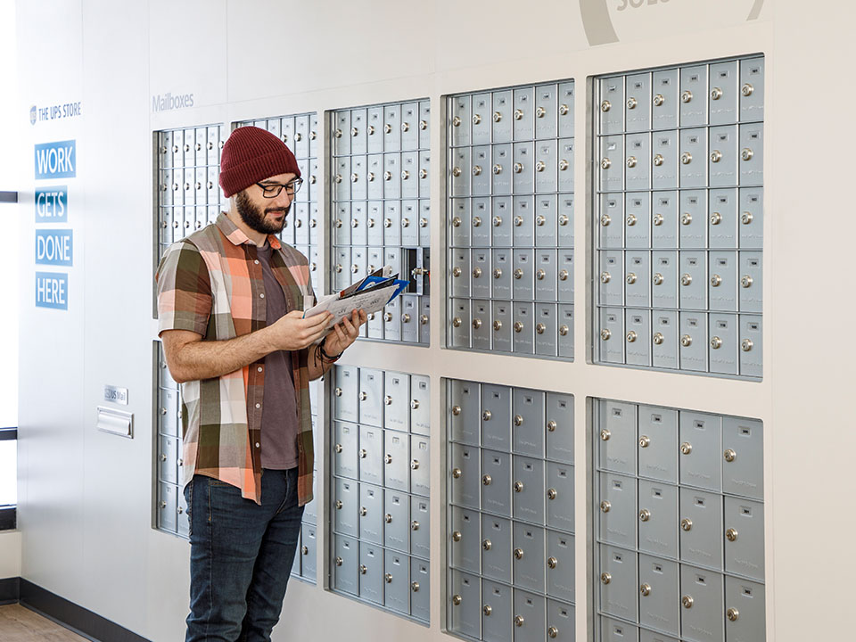 Customer using mailbox at The UPS Store