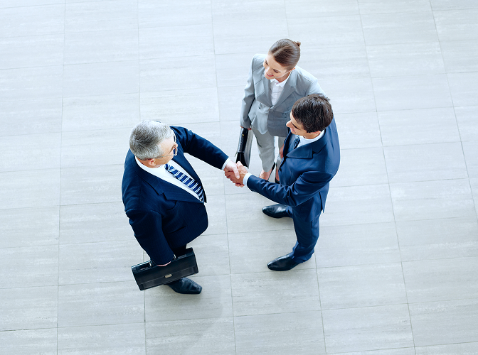 Private bankers shaking hands.