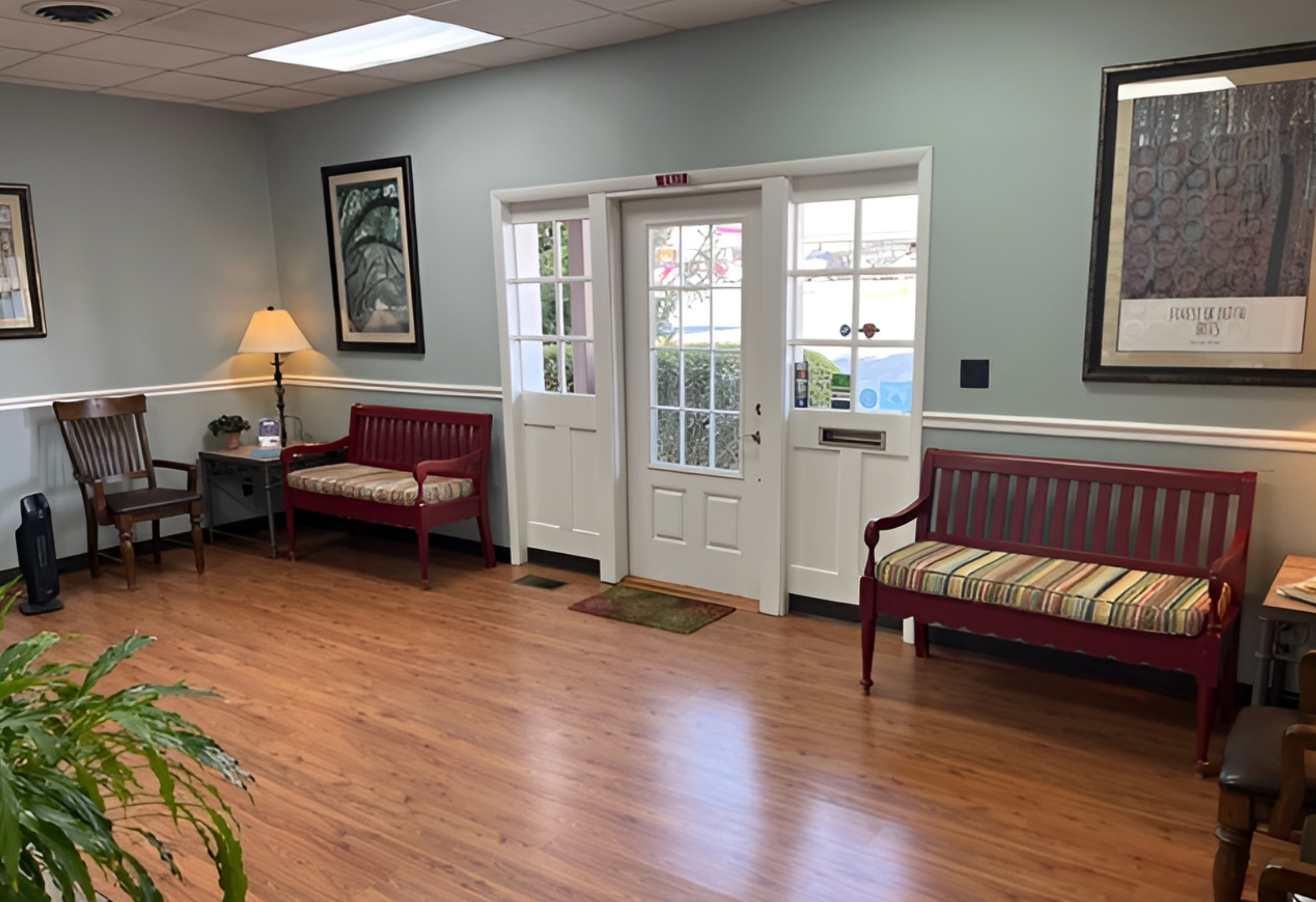 Spacious and welcoming waiting room at Hill Family Dental Columbia with comfortable seating and warm lighting.