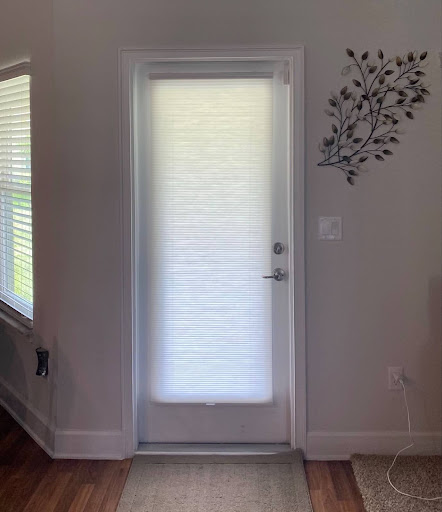 These cellular shades, installed in a home on the Space Coast, beautifully complement this door.   Ready to elevate your space? Call us today at (321) 446-7746 to upgrade your home next!