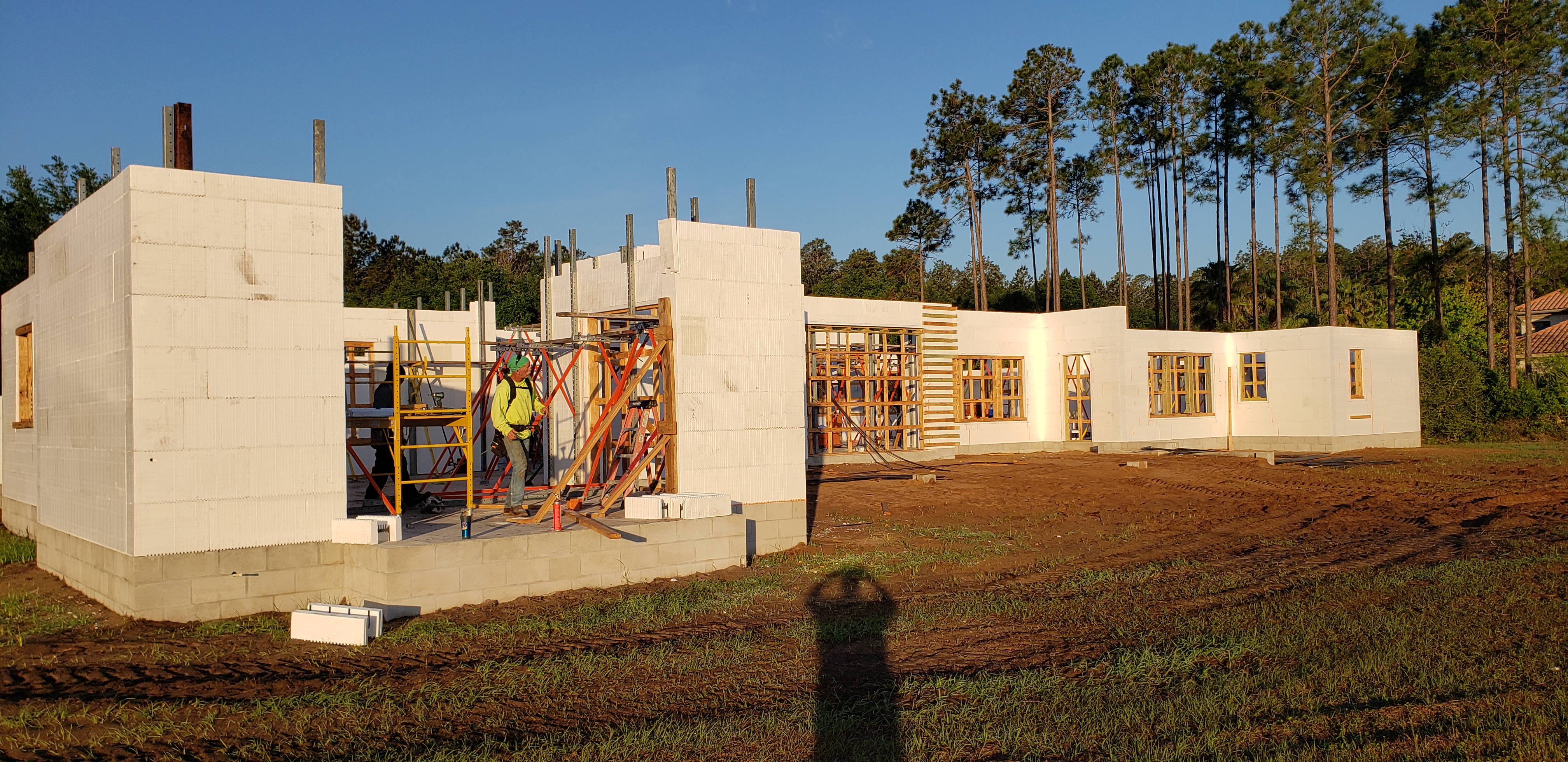 A construction site with a house under construction. The walls are made of white insulated concrete  