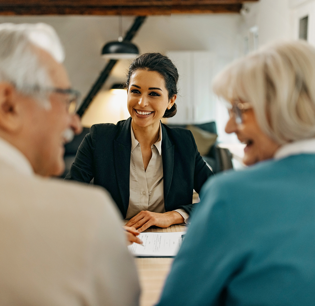 An investment advisor serving her clients at the office.
