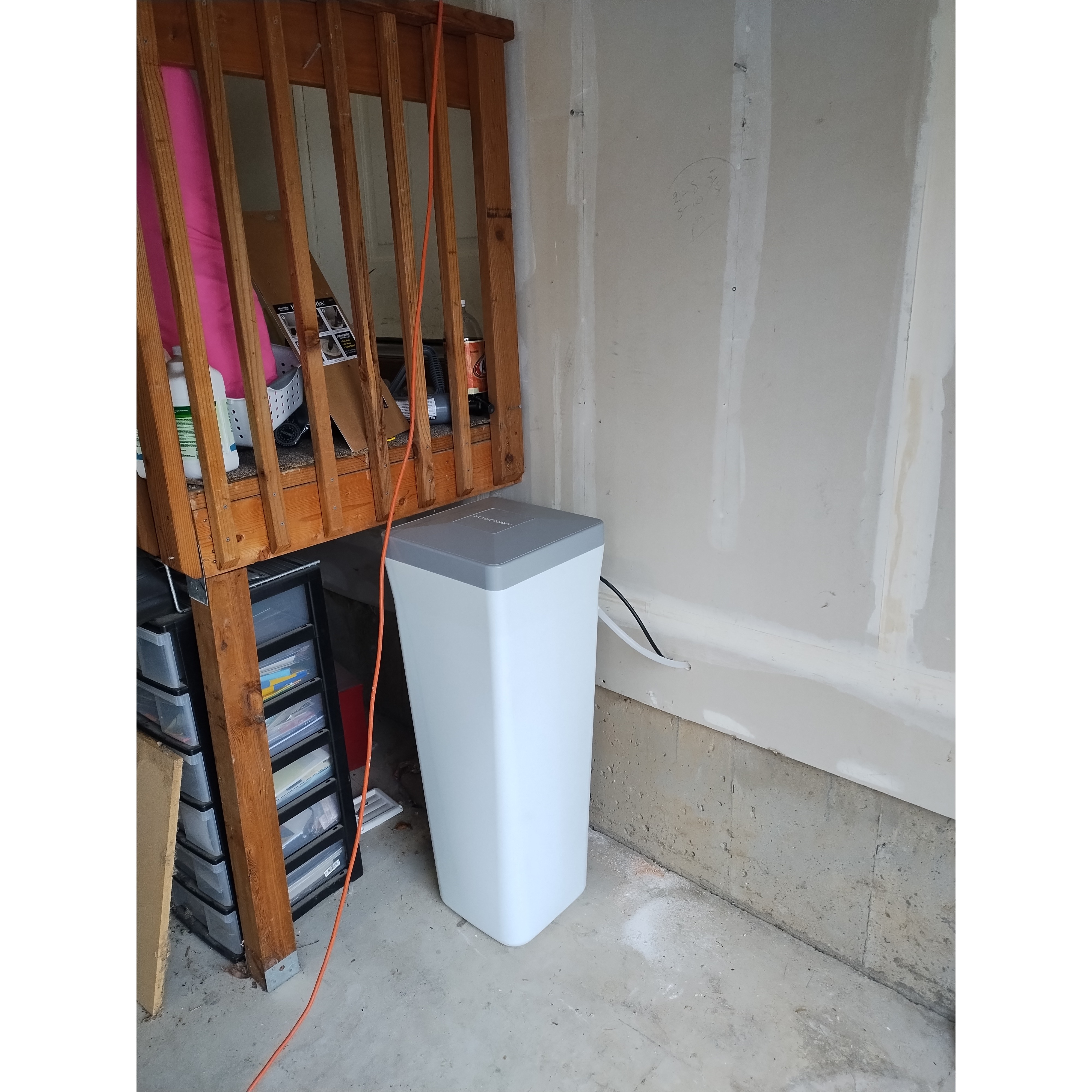 Water softener brine tank in garage.