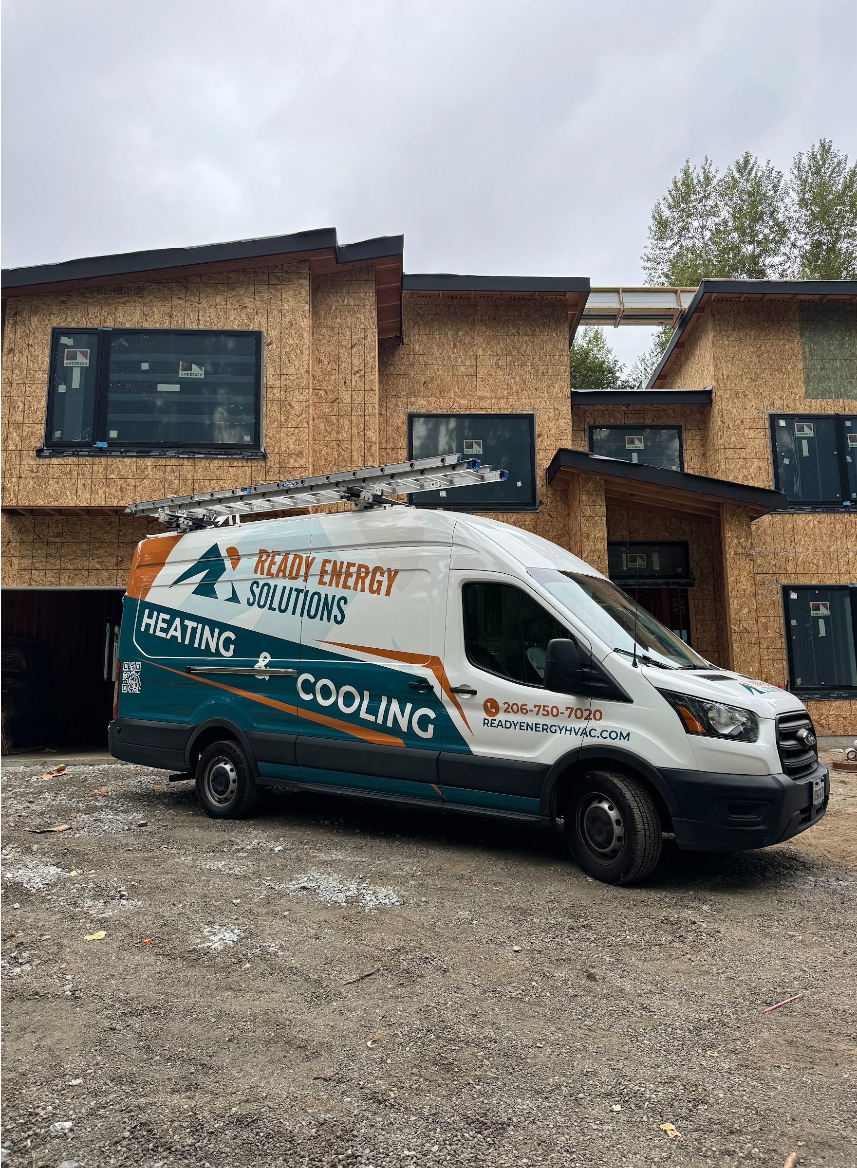 Ready Energy Solutions heating and cooling van at a new construction townhome project. HVAC installation for builders and homeowners across Greater Seattle.