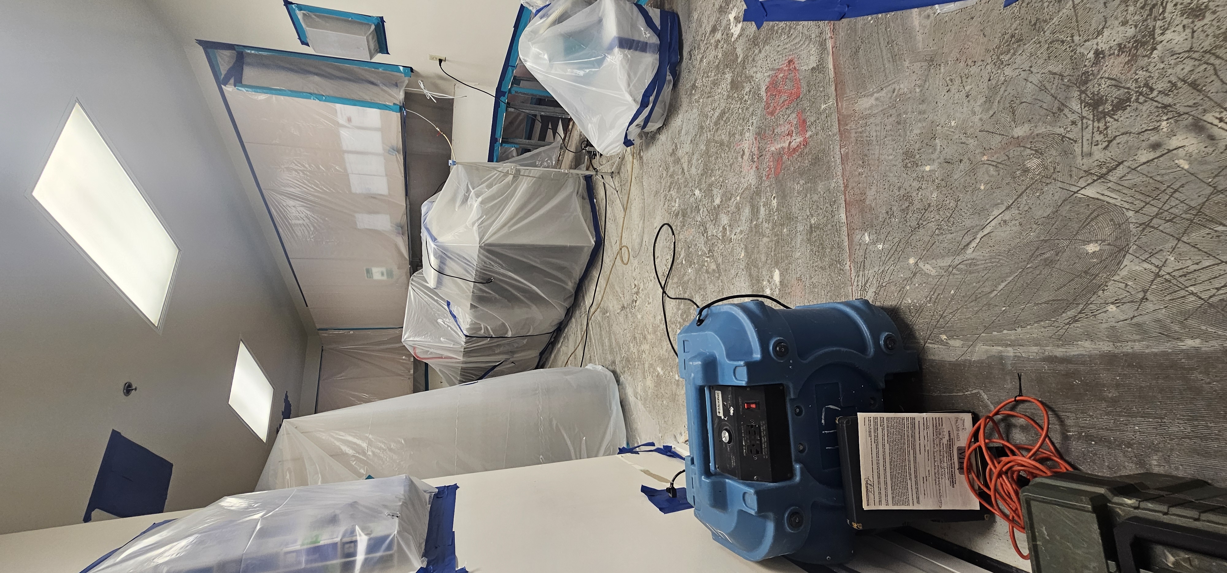 Professional drying equipment set up inside a commercial space to remove moisture and support water damage restoration.