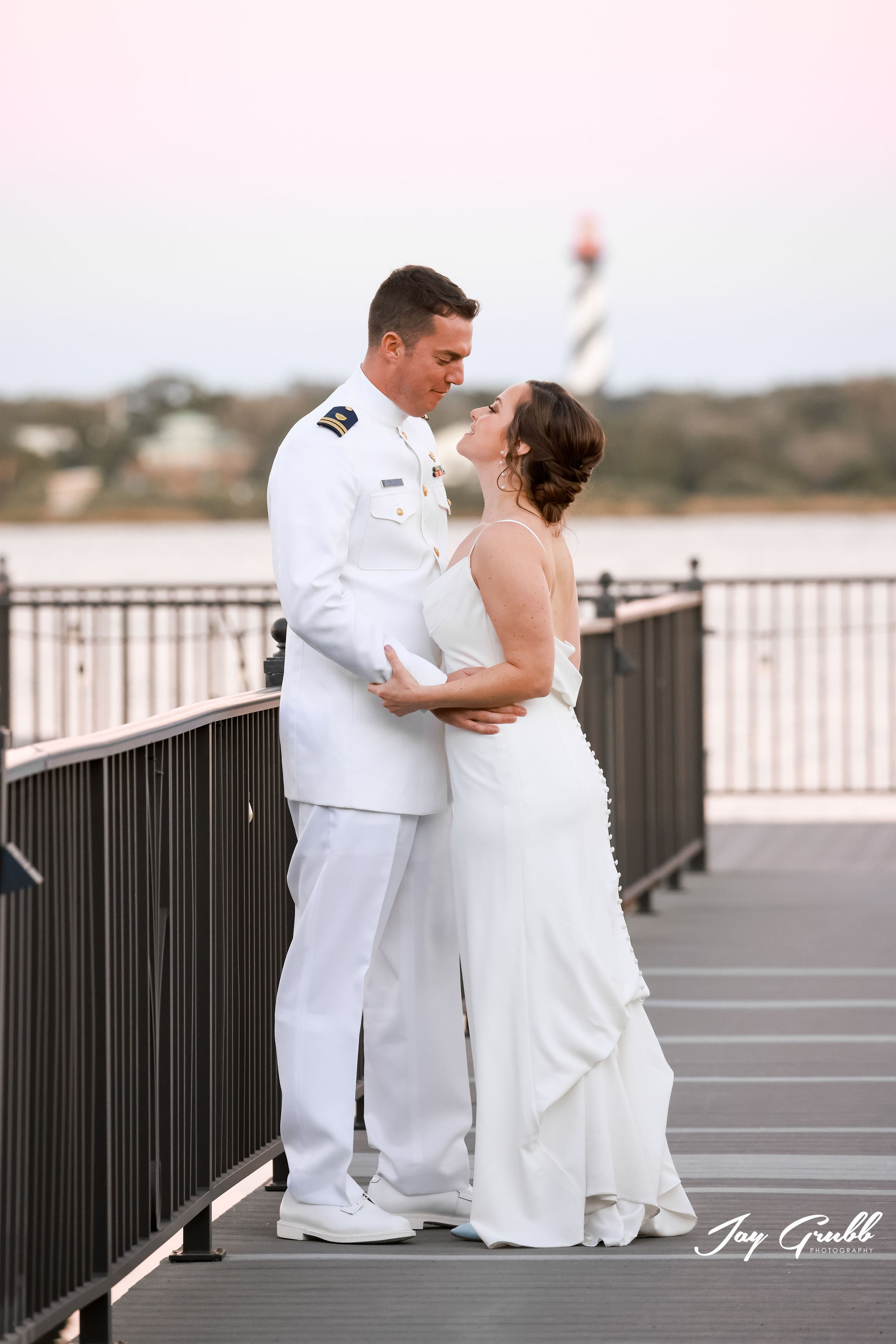 groom in military outfit with wife at river house events 