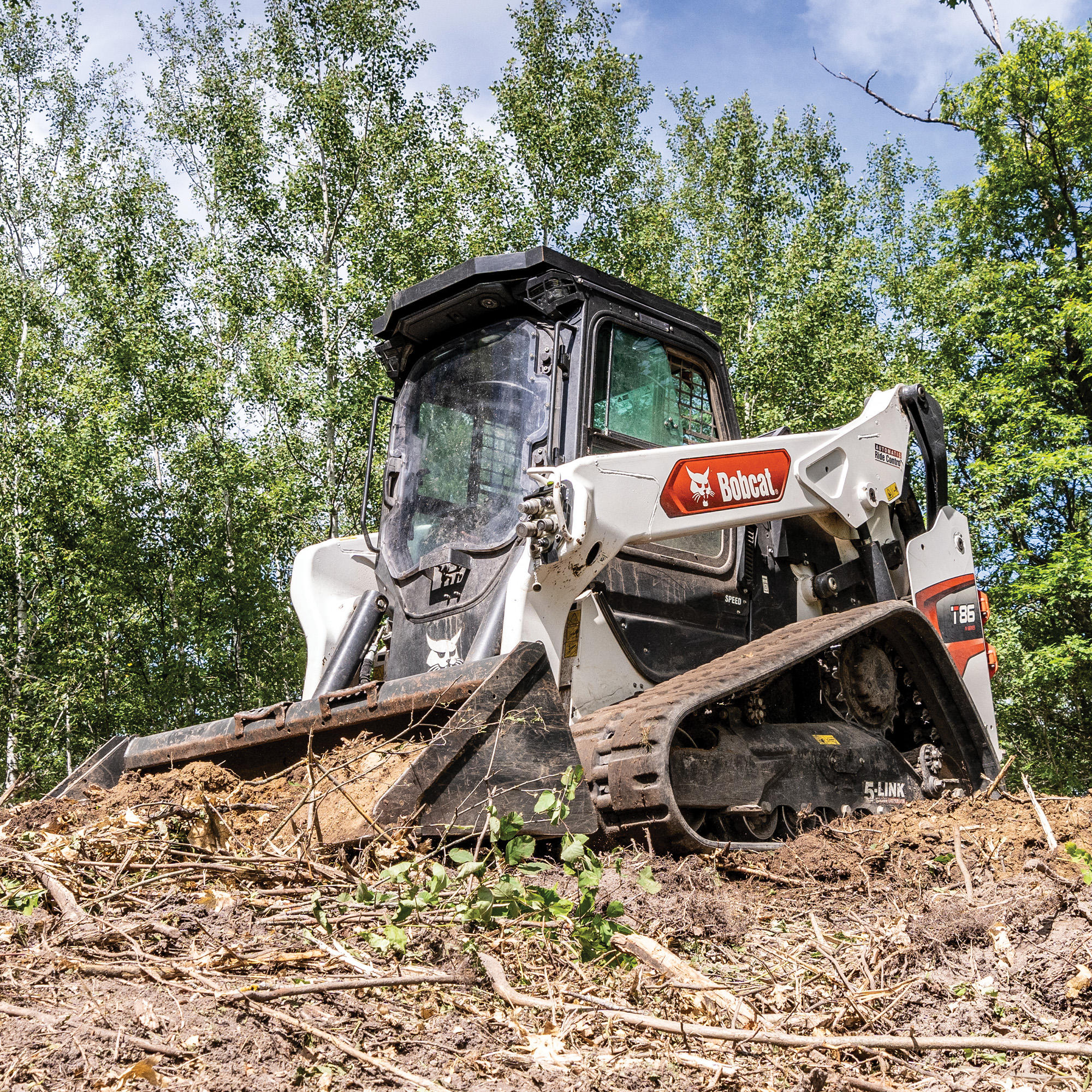 Bobcat T86, brush removal with bucket Paul Equipment Fredericton (506)449-3289