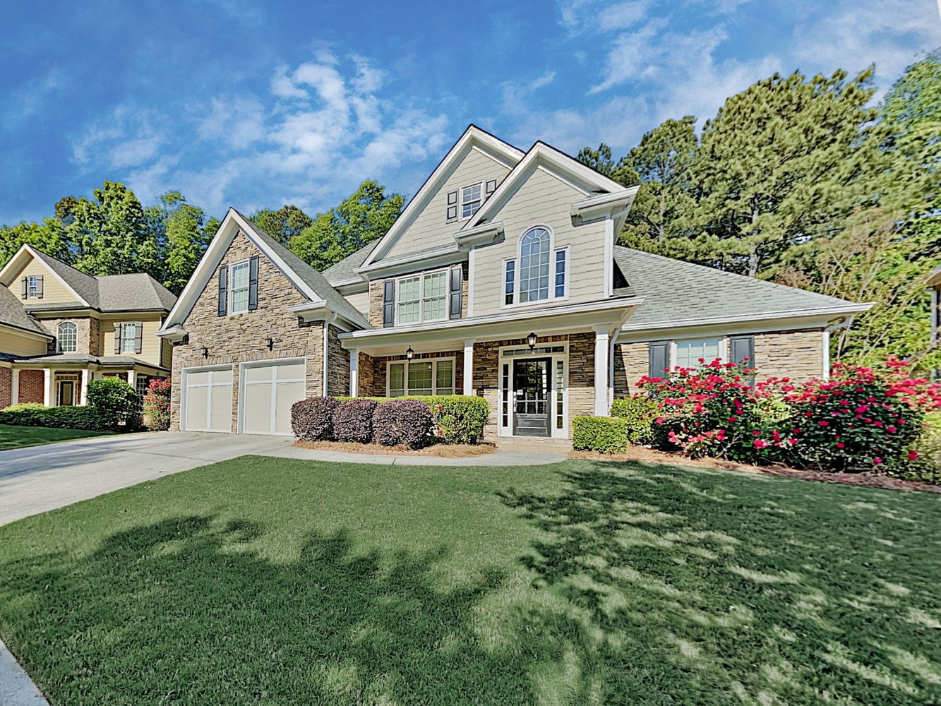 Stunning home with large garage and quaint porch at Invitation Homes Atlanta.