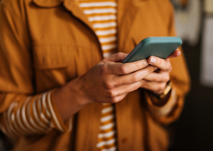 A client accessing their RBC account on their phone.