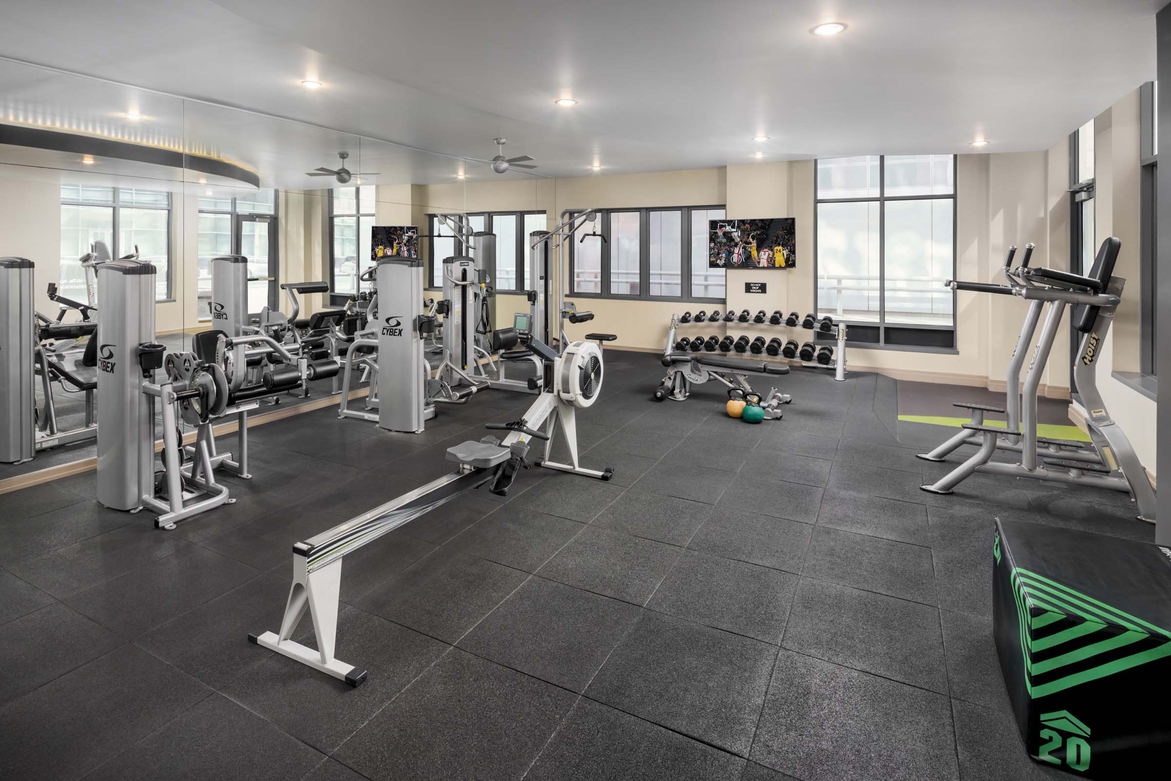 Fitness center with free weights and strength training equipment at Camden NoMa Apartments in Washington, DC.