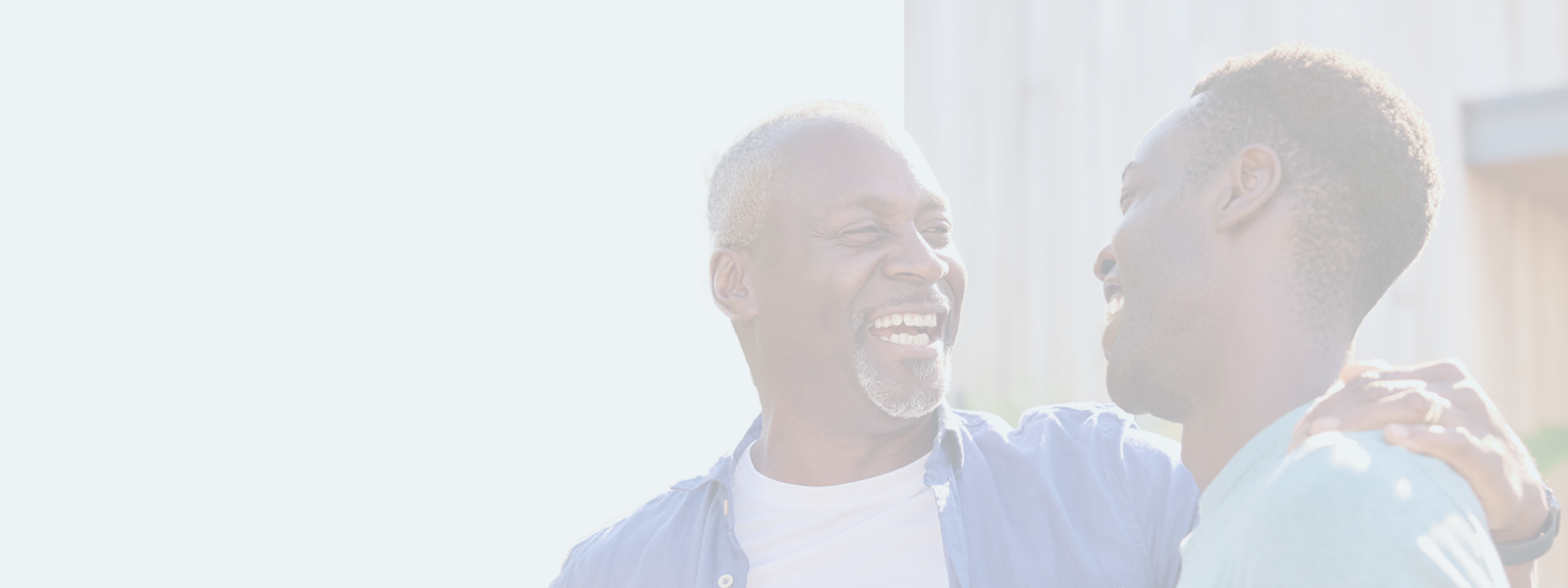 Father and son laughing together.