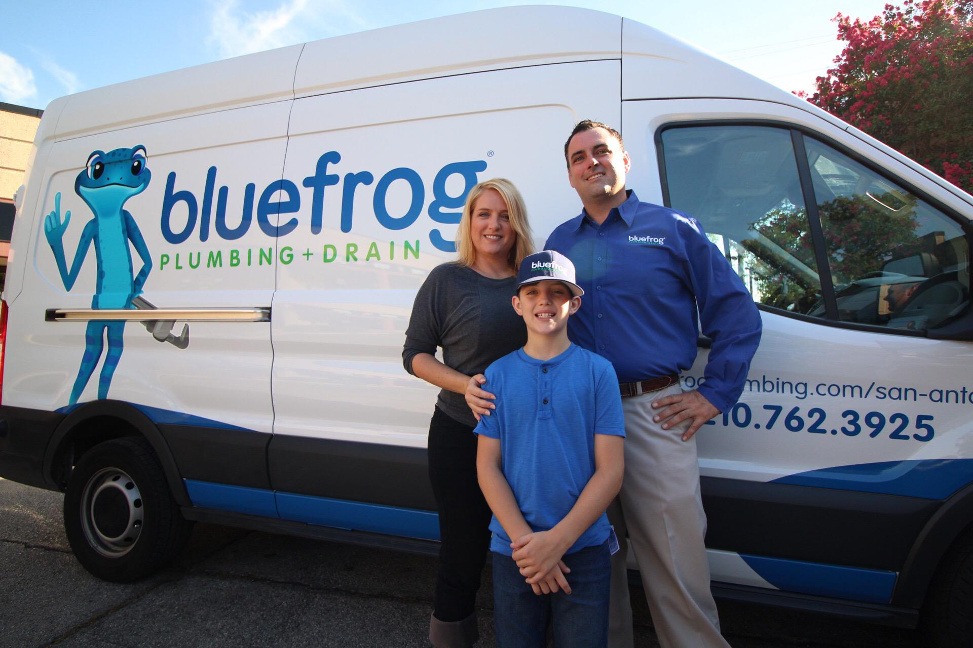The amazing bluefrog Plumbing + Drain of San Antonio family with one if the plumbing repair trucks.