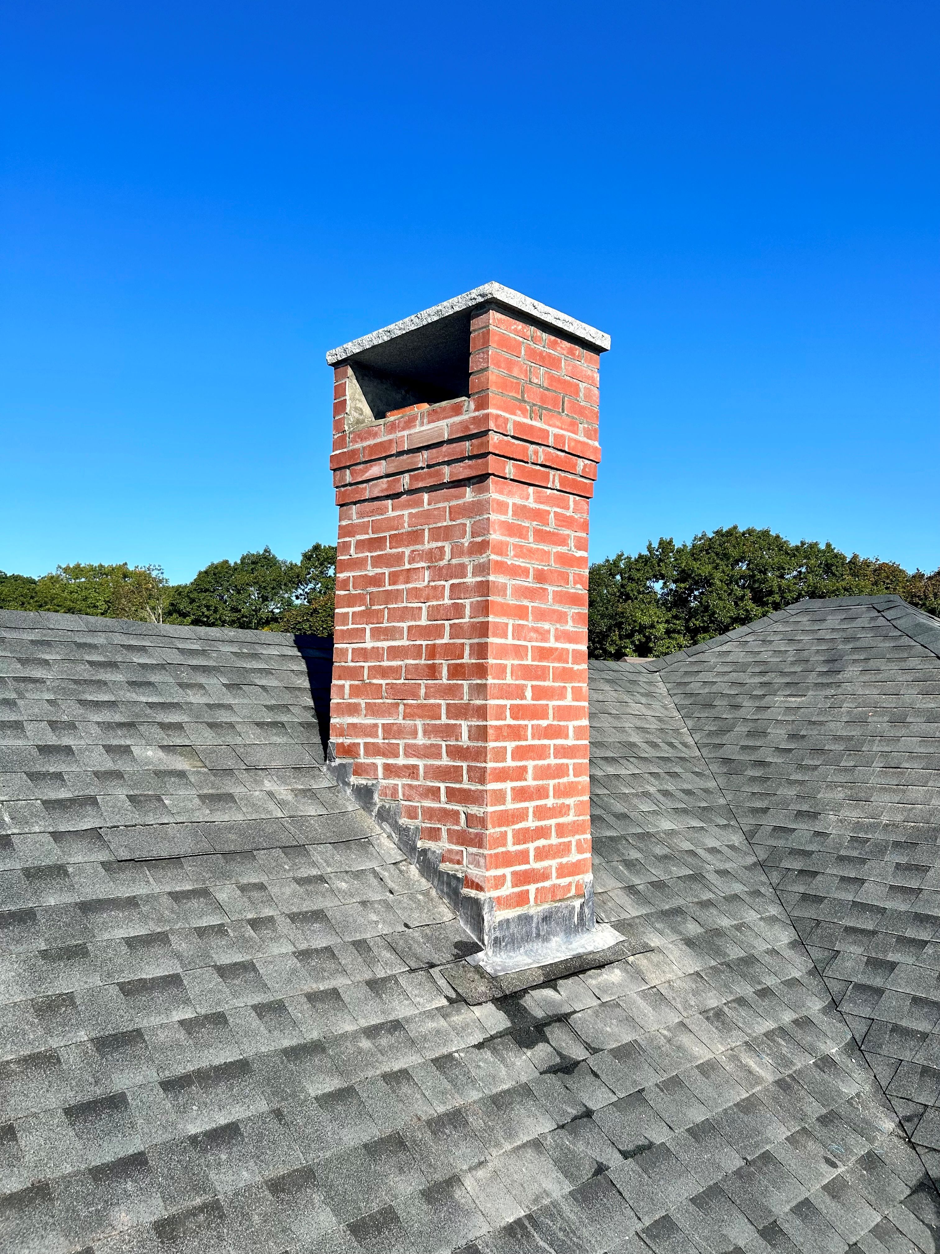 Custom brick chimney built and restored by Mac's Masonry, combining traditional masonry craftsmanship with durable materials for long-lasting performance and curb appeal.