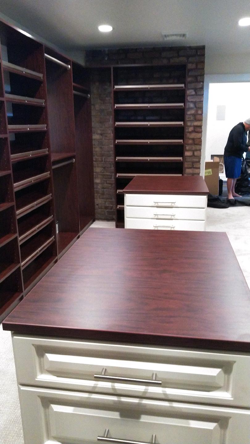 Custom walk in closet in Bellwood. Custom finish. Custom jewelry tray drawer island