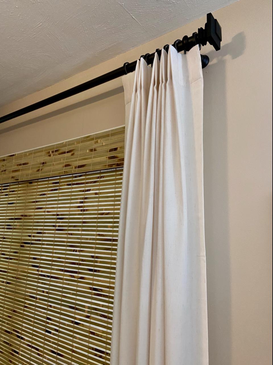 Zoom in here on this window from Worcester to get a look at the fine details! Here you can see our Draperies on a beautifully finished rod to go with these awesome Woven Wood Shades!