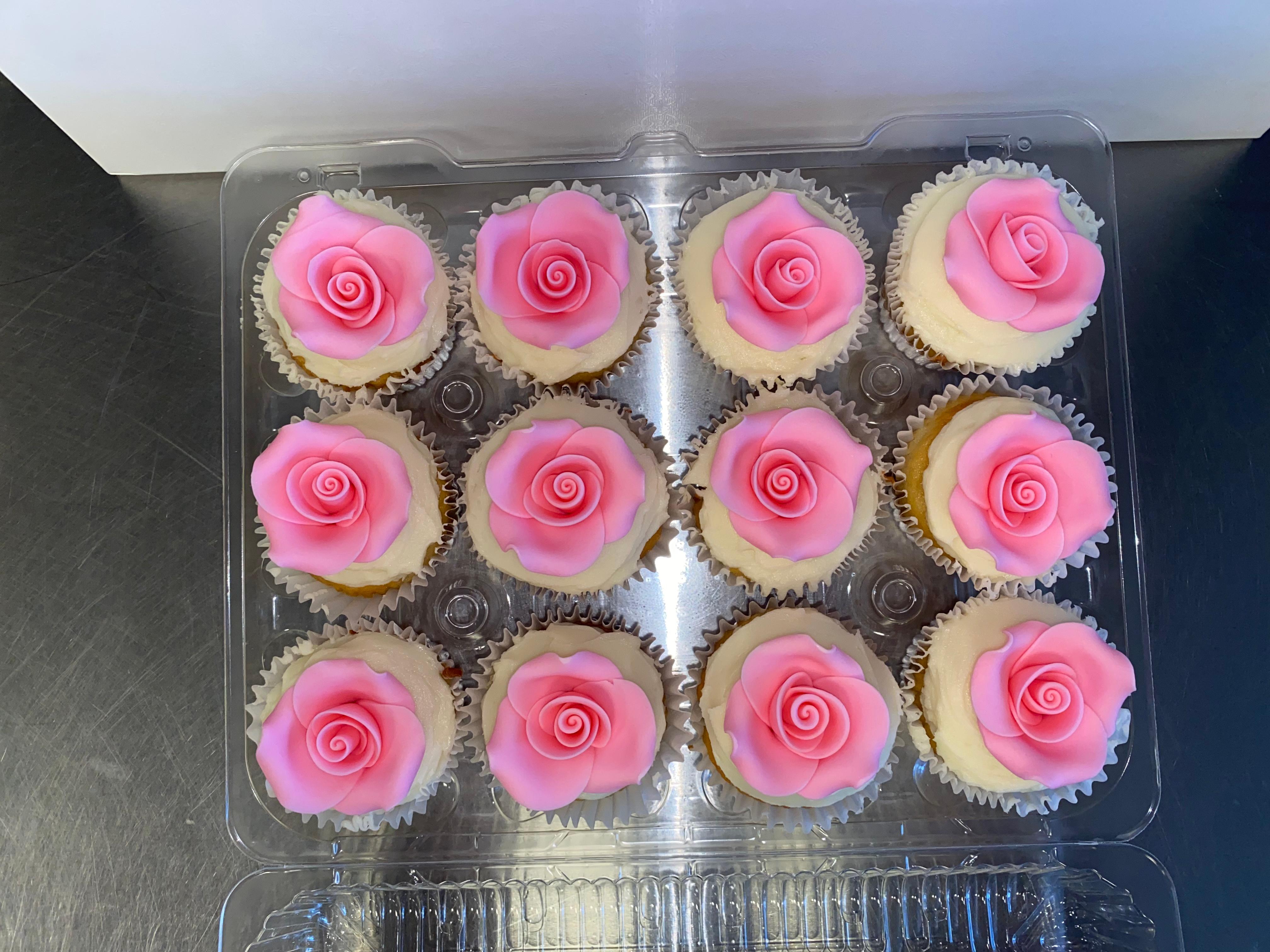 A very fun custom cupcake order with flower decorations!