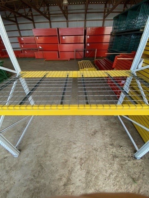 Wire decking installed on a pallet racking system.